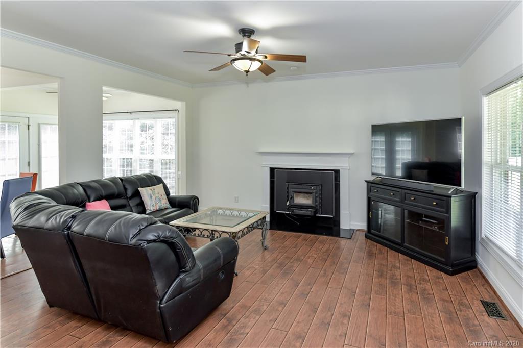 2425 Lakeview Circle Matthews, NC 28105 - Photo 6 of 33 a living room with furniture and a fireplace