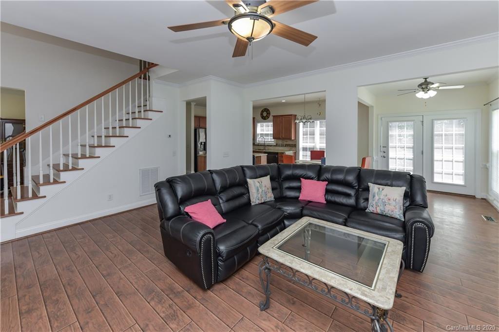 2425 Lakeview Circle Matthews, NC 28105 - Photo 8 of 33 a living room with furniture and wooden floor