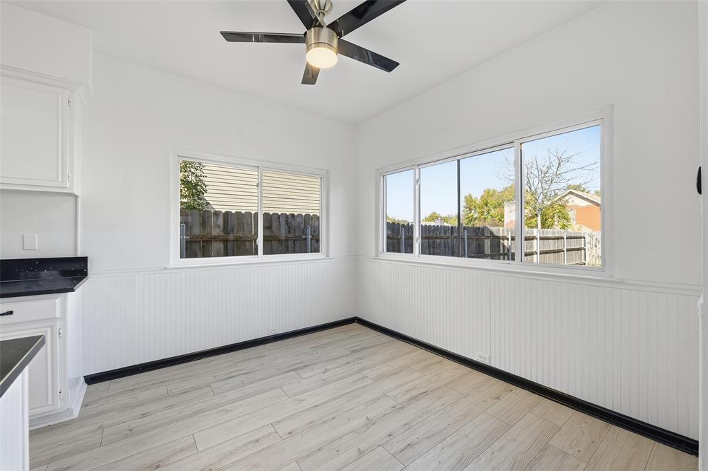 10120 Long Rifle Drive Fort Worth, TX 76108 - Photo 12 of 28 an empty room with wooden floor and windows