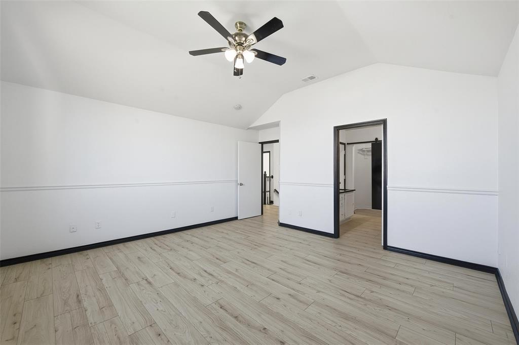 10120 Long Rifle Drive Fort Worth, TX 76108 - Photo 16 of 28 a view of a livingroom with wooden floor and a ceiling fan