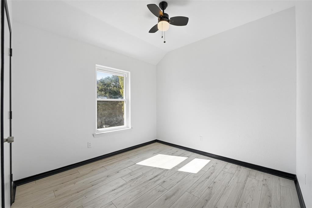 10120 Long Rifle Drive Fort Worth, TX 76108 - Photo 22 of 28 an empty room with wooden floor and windows