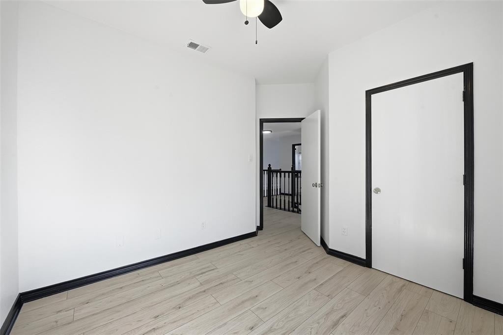 10120 Long Rifle Drive Fort Worth, TX 76108 - Photo 23 of 28 a view of an empty room with wooden floor