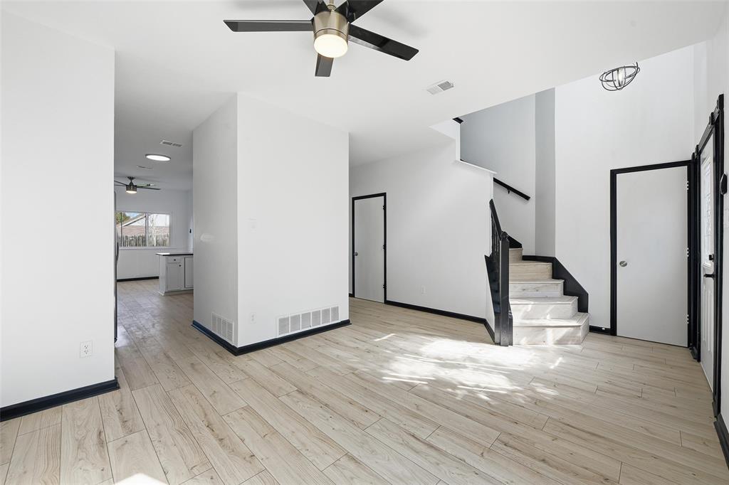 10120 Long Rifle Drive Fort Worth, TX 76108 - Photo 6 of 28 a view of a hallway with wooden floor and staircase