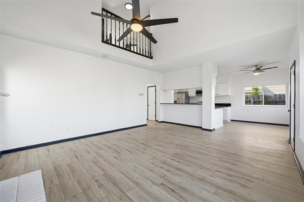 10120 Long Rifle Drive Fort Worth, TX 76108 - Photo 8 of 28 a view of a kitchen with wooden floor and windows