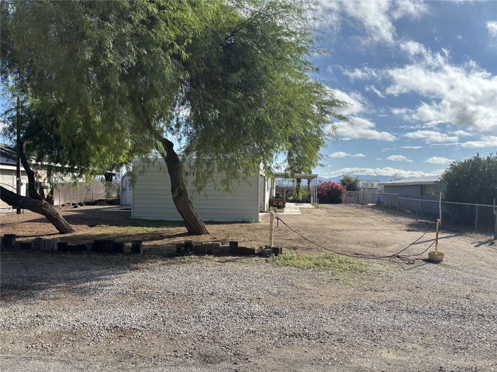 1770 Riviera Drive Blythe, CA 92225 - Photo 18 of 23 a backyard of a house with barbeque oven table and chairs