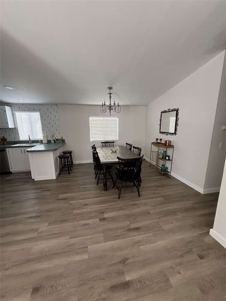 1770 Riviera Drive Blythe, CA 92225 - Photo 2 of 23 a living room with furniture and a dining table with wooden floor