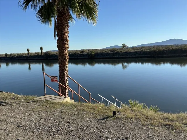 a backyard of a house with lake view