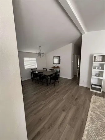 a room with furniture and a wooden floor