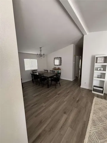 a room with furniture and a wooden floor