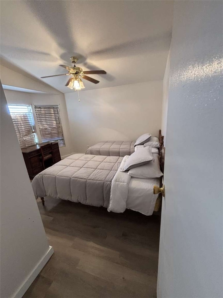 1770 Riviera Drive Blythe, CA 92225 - Photo 6 of 23 a bedroom with a bed and a chandelier