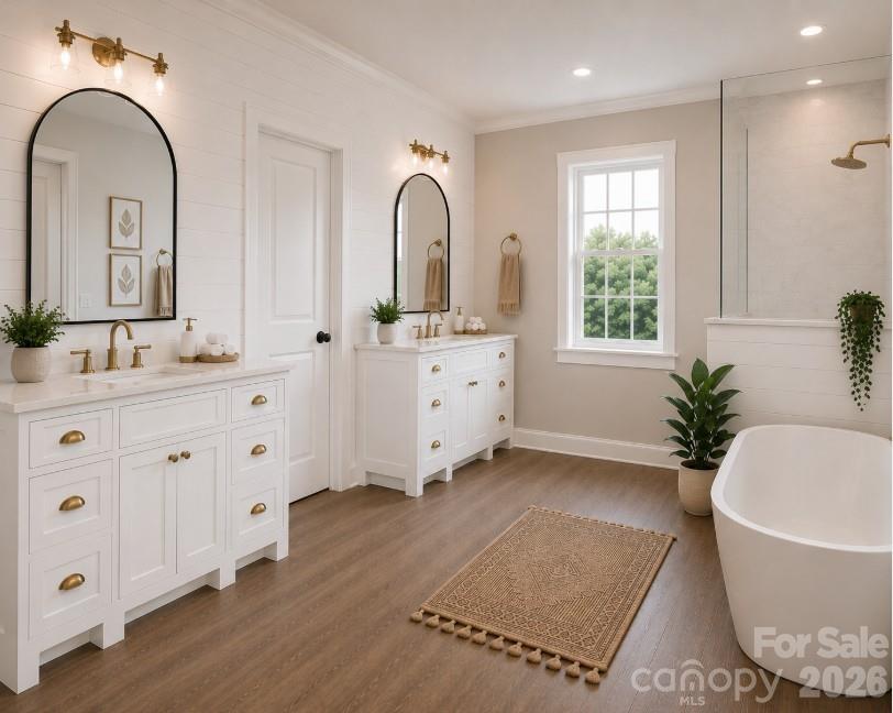 9745 Flowes Store Road Midland, NC 28107 - Photo 15 of 20 a spacious bathroom with a granite countertop tub a double vanity sink a window and a mirror