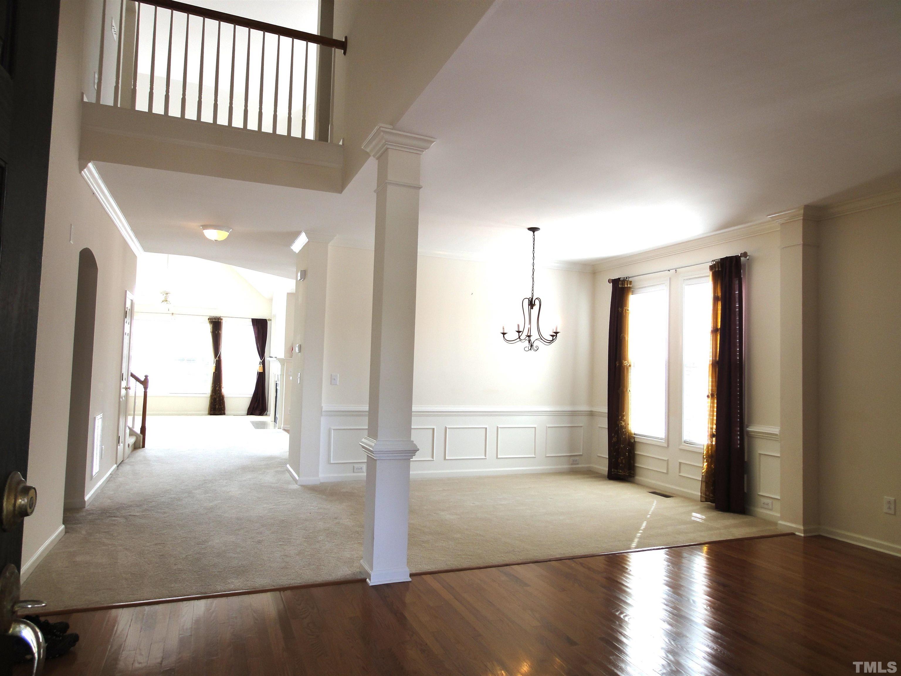 123 North Fields Circle Chapel Hill, NC 27516 - Photo 6 of 24 a view of a hallway with wooden floor and windows