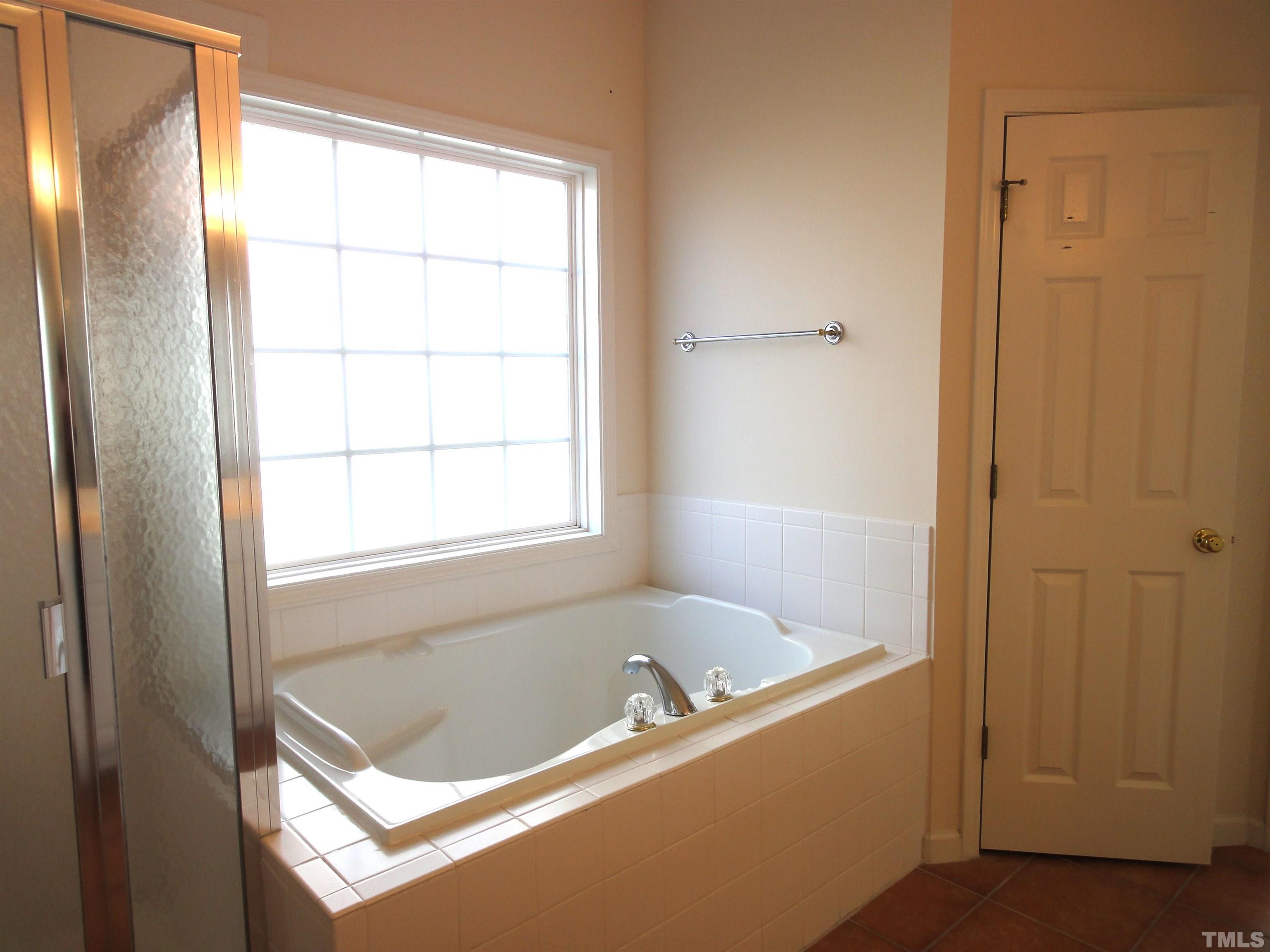 123 North Fields Circle Chapel Hill, NC 27516 - Photo 9 of 24 a bathroom with a bathtub and shower