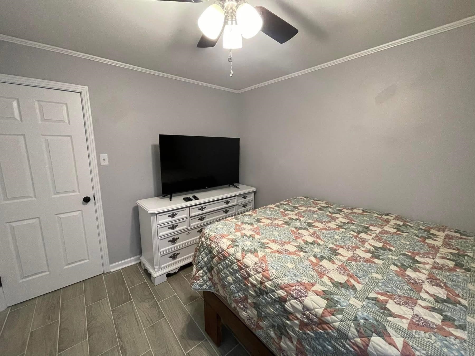 2003 Bond Ferry Road Brownsville, TN 38012 - Photo 11 of 16 Bedroom with ornamental molding, wood finish floors, and a ceiling fan