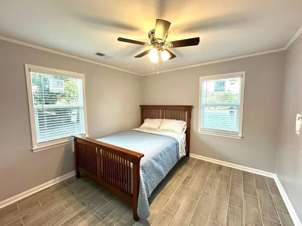 a bedroom with a bed and window