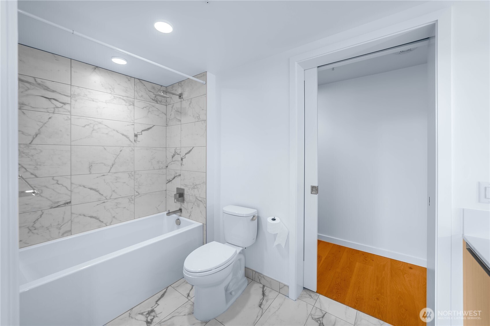 1808 Minor Avenue, Unit 912 Seattle, WA 98101 - Photo 12 of 39 a bathroom with a toilet a sink and bathtub