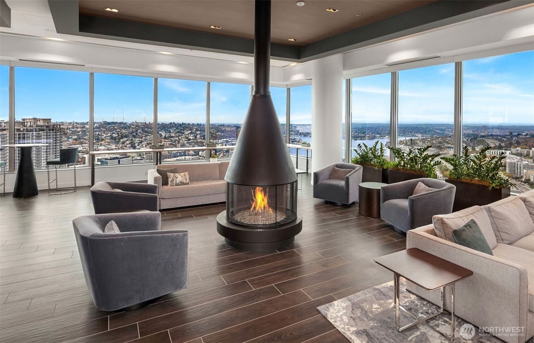 1808 Minor Avenue, Unit 912 Seattle, WA 98101 - Photo 23 of 39 a living room with couches and a coffee table with wooden floor