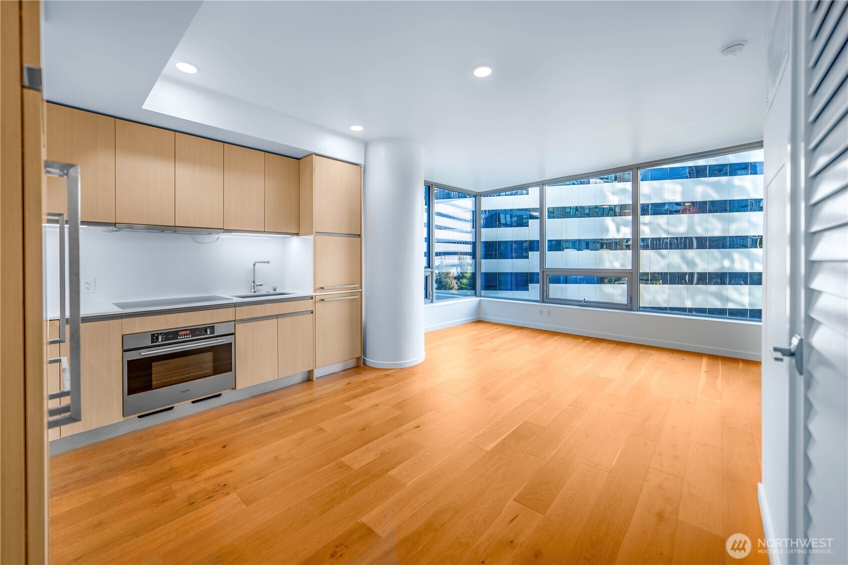 1808 Minor Avenue, Unit 912 Seattle, WA 98101 - Photo 6 of 39 a view of an empty room with a fireplace and a window