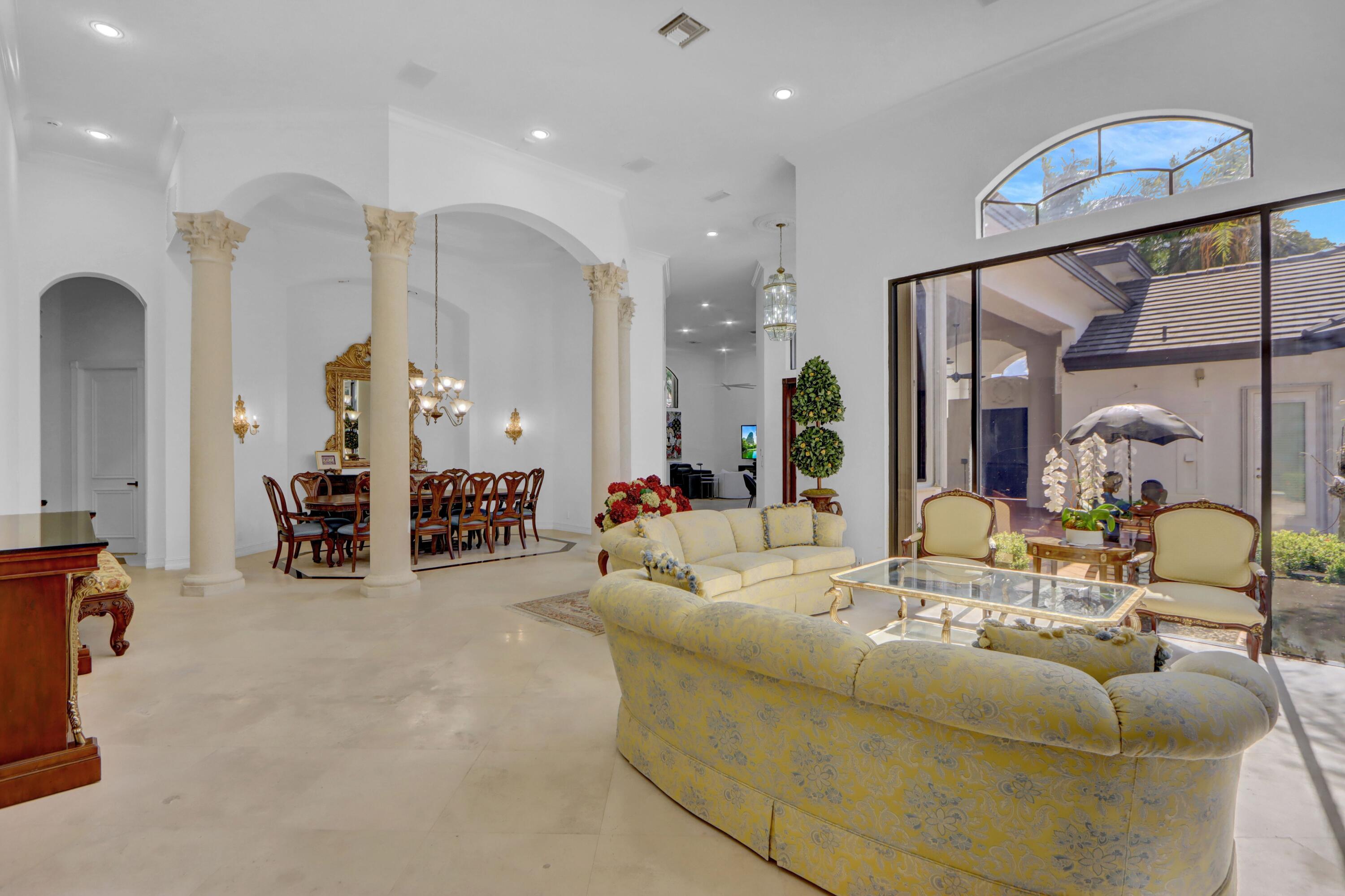 3799 Northwest Coventry Lane Boca Raton, FL 33496 - Photo 4 of 49 a living room with furniture and a large window