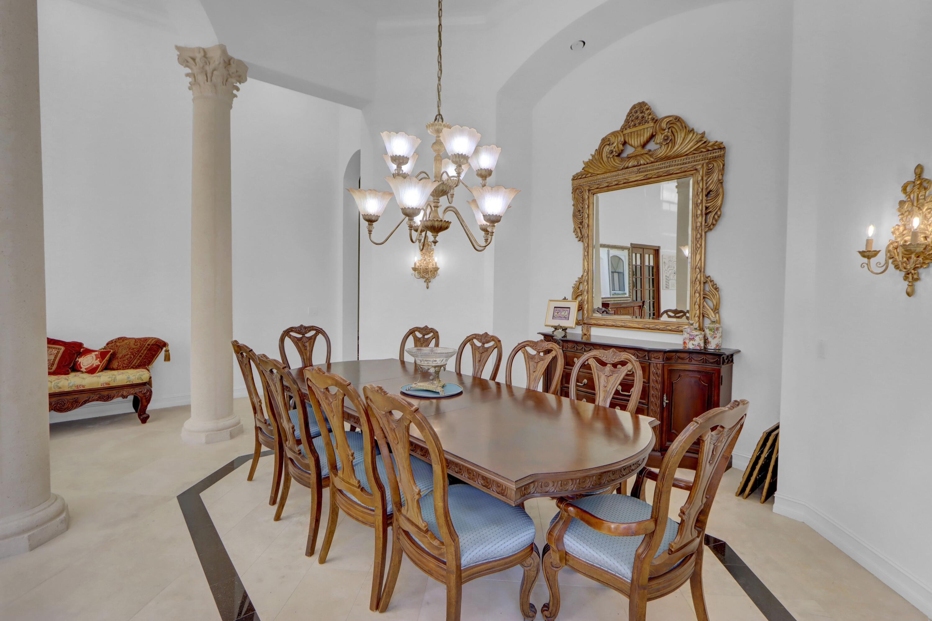 3799 Northwest Coventry Lane Boca Raton, FL 33496 - Photo 5 of 49 a dining room with furniture and chandelier