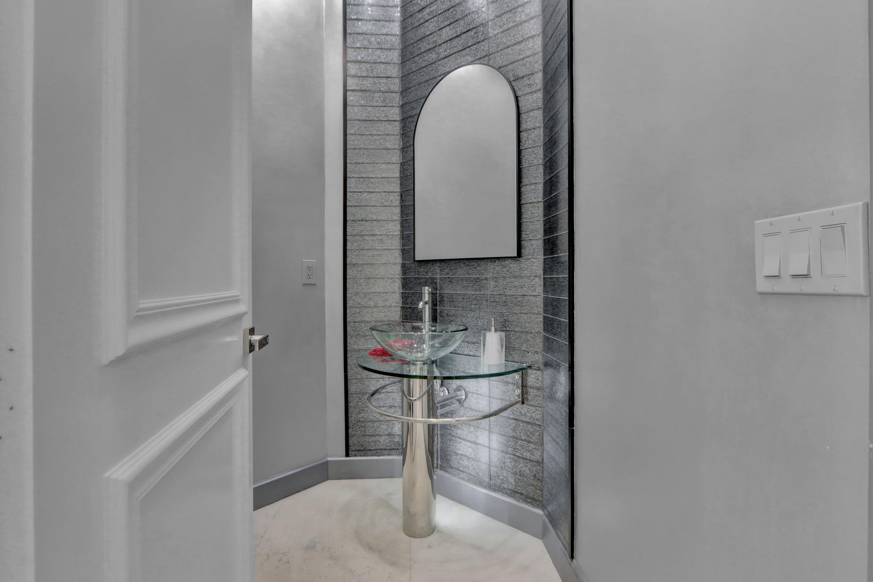 3799 Northwest Coventry Lane Boca Raton, FL 33496 - Photo 7 of 49 a bathroom with a sink and a mirror