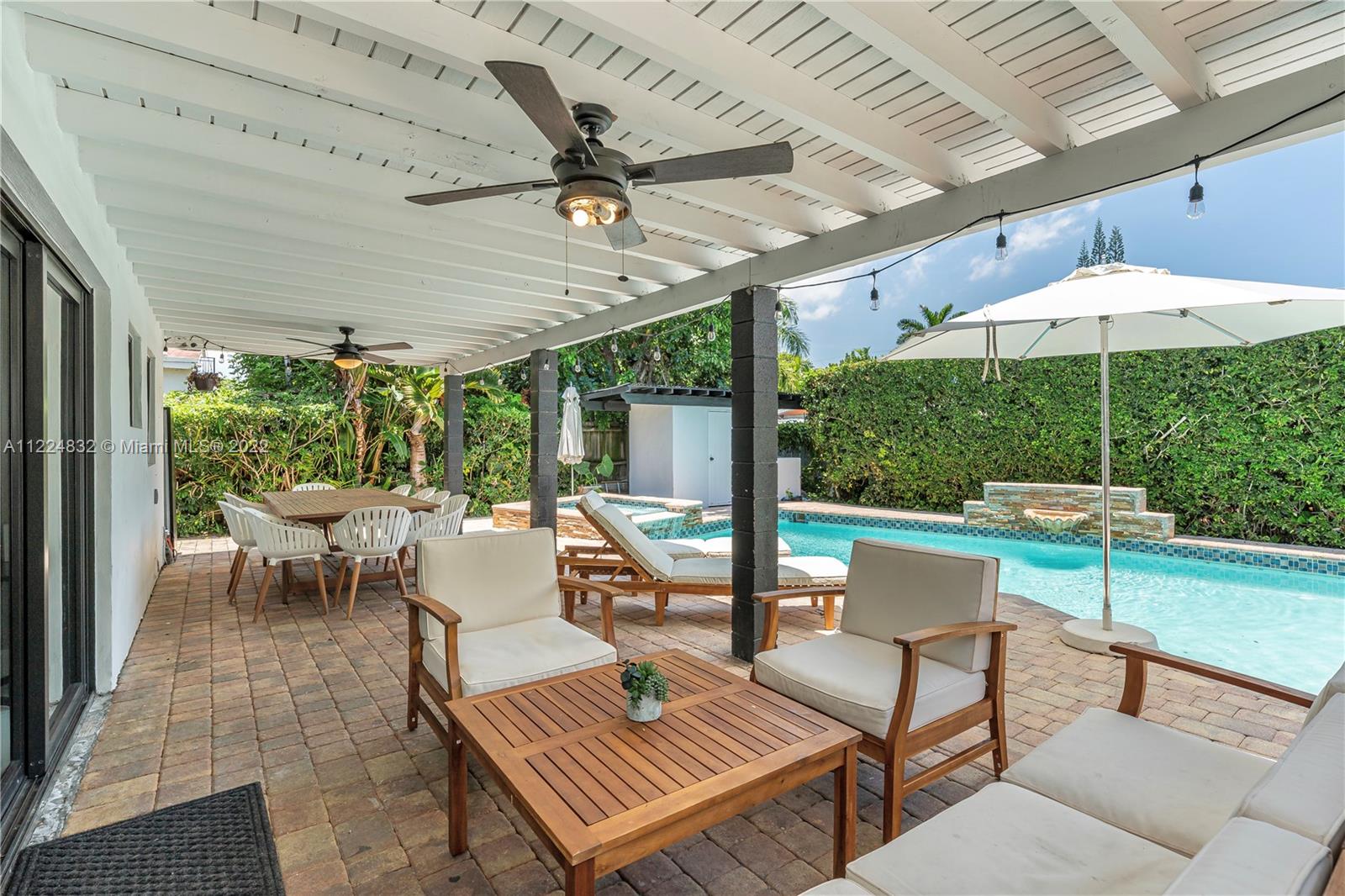 401 Southwest 23rd Road Miami, FL 33129 - Photo 15 of 25 a outdoor space with patio the couches and pool table with chairs