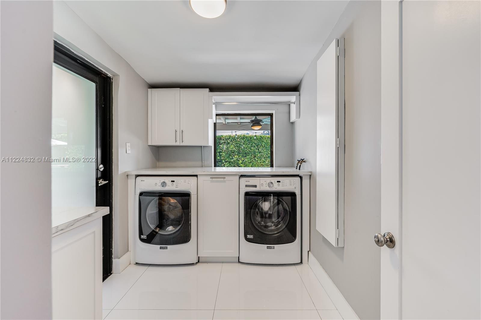 401 Southwest 23rd Road Miami, FL 33129 - Photo 16 of 25 a utility room with closet a washer and dryer