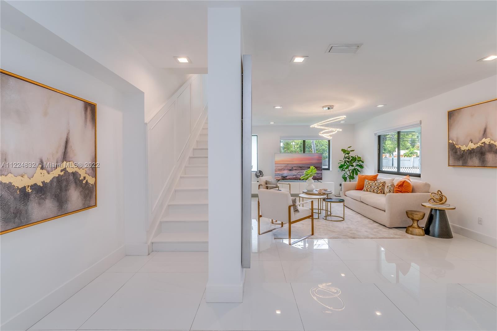 401 Southwest 23rd Road Miami, FL 33129 - Photo 3 of 25 a living room with furniture and a flat screen tv