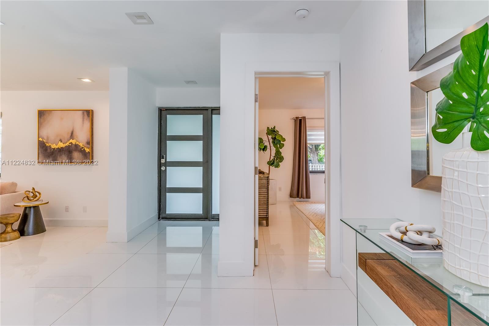 401 Southwest 23rd Road Miami, FL 33129 - Photo 8 of 25 a kitchen with stainless steel appliances granite countertop a refrigerator and a sink