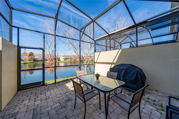 a view of a chairs and table in the patio