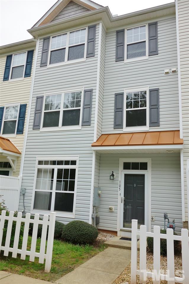 2225 Raven Road, Unit 105 Raleigh, NC 27614 - Photo 1 of 16 a front view of a building with a yard