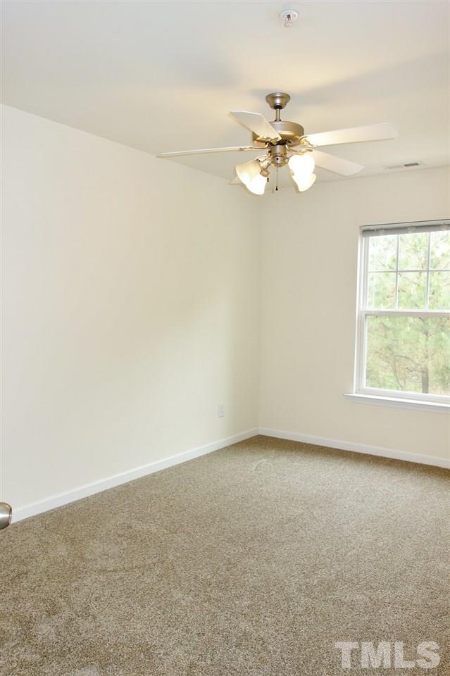 2225 Raven Road, Unit 105 Raleigh, NC 27614 - Photo 14 of 16 an empty room with a window and a ceiling fan