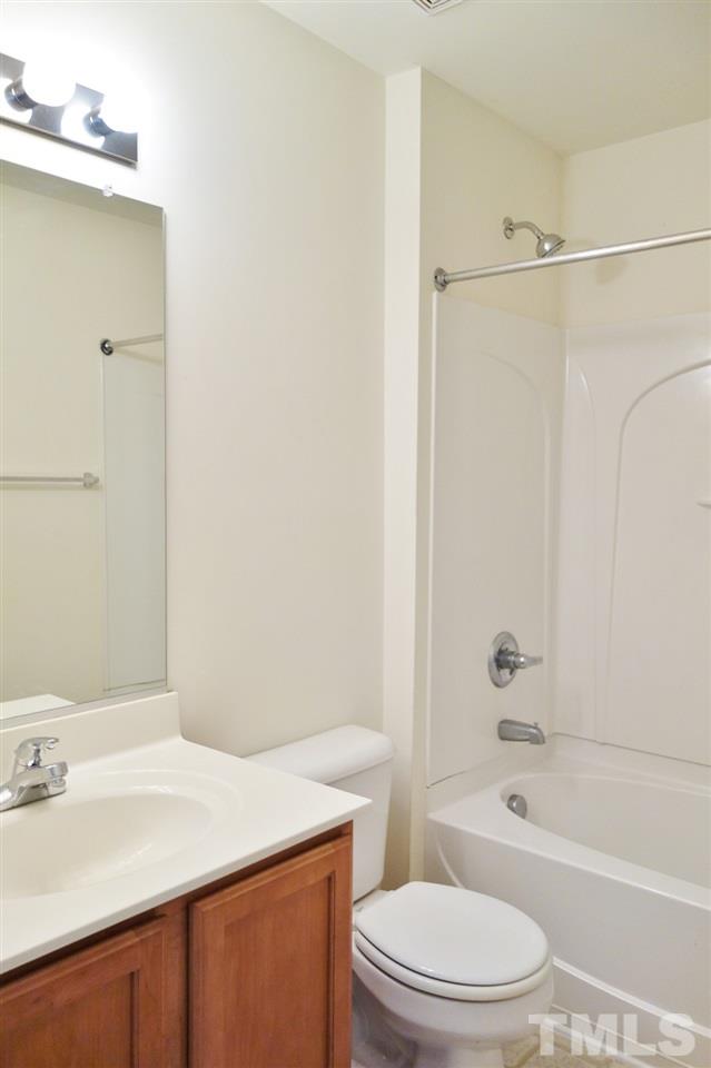 2225 Raven Road, Unit 105 Raleigh, NC 27614 - Photo 15 of 16 a bathroom with a sink a toilet and shower