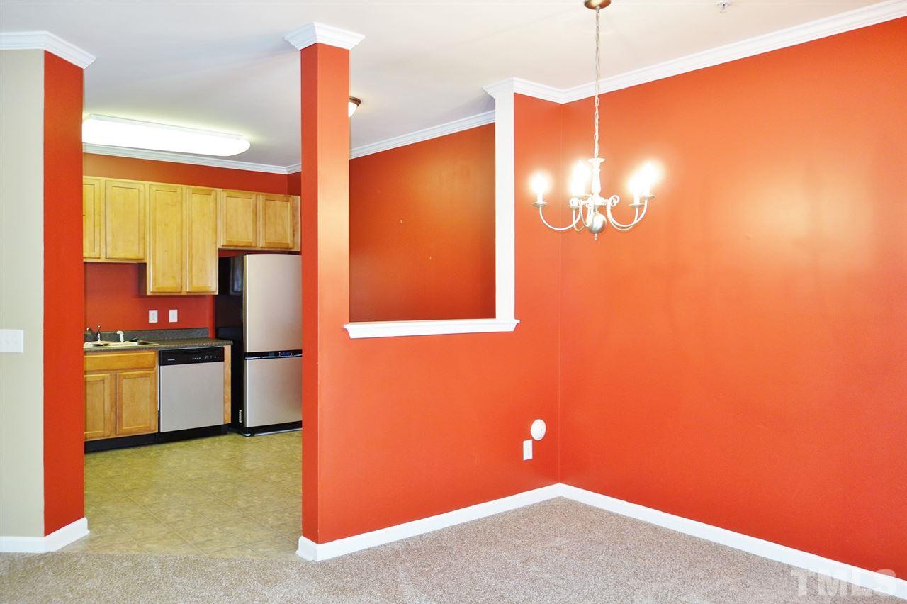2225 Raven Road, Unit 105 Raleigh, NC 27614 - Photo 3 of 16 a kitchen with a refrigerator and a stove