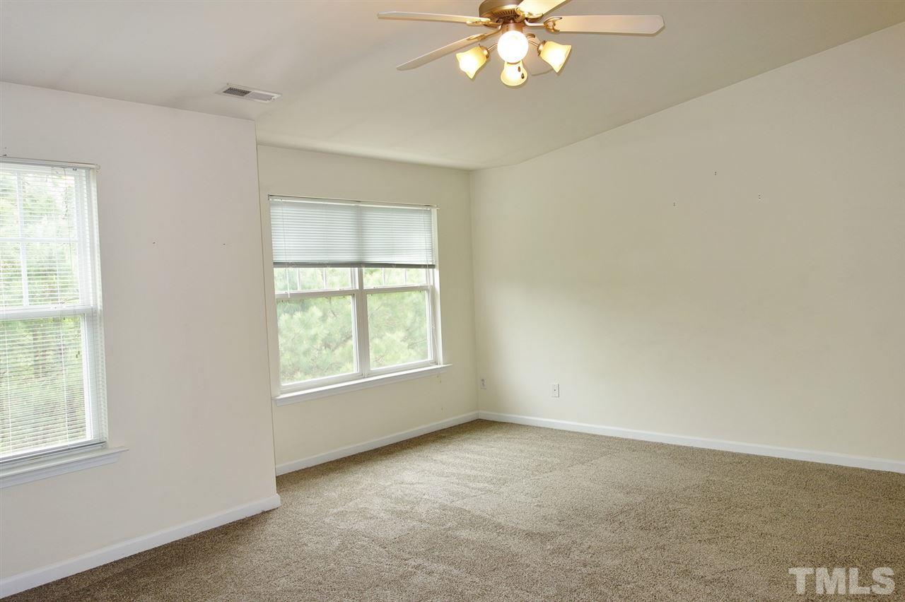 2225 Raven Road, Unit 105 Raleigh, NC 27614 - Photo 7 of 16 an empty room with a window