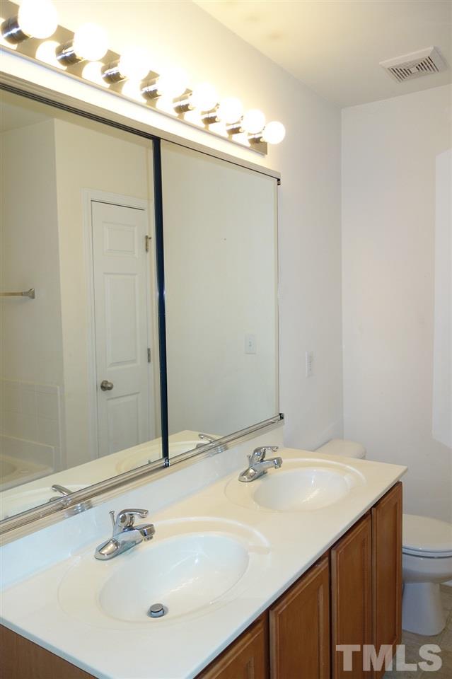 2225 Raven Road, Unit 105 Raleigh, NC 27614 - Photo 10 of 16 a bathroom with a sink and a mirror