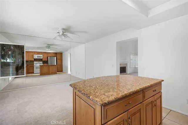 a kitchen with a sink and a refrigerator
