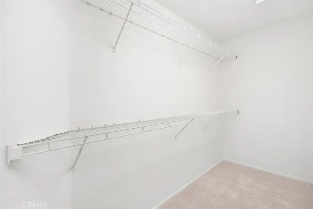 a view of a porch with furniture and garden