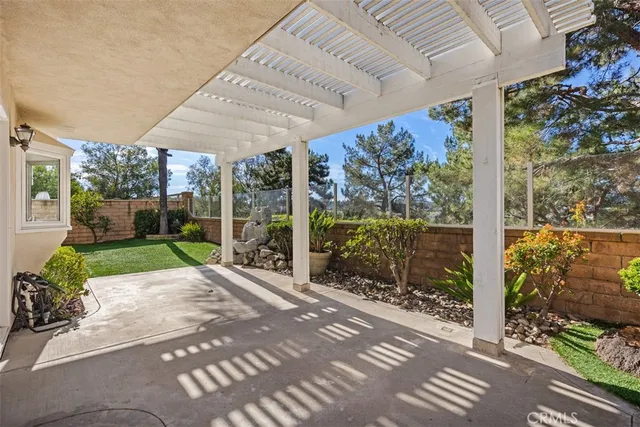 a view of a house with a yard porch and sitting area