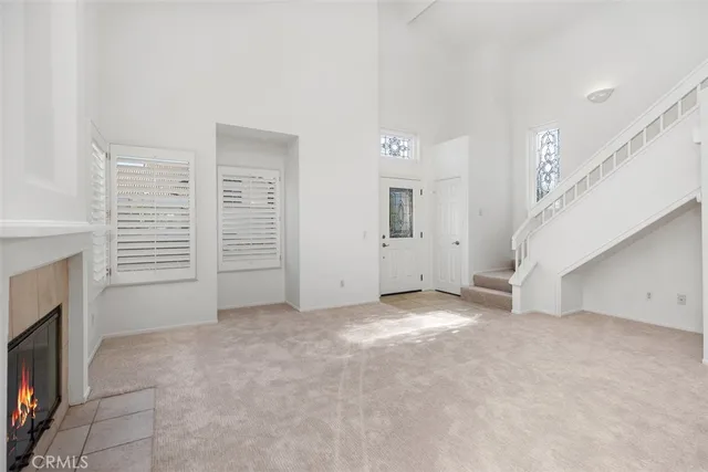 a view of an empty room with a fireplace