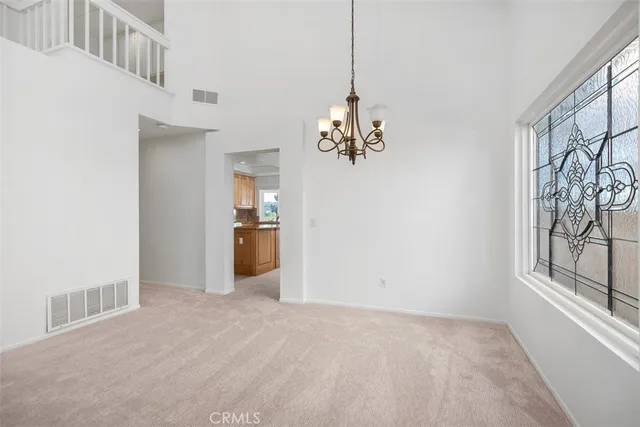a view of a hallway with a chandelier