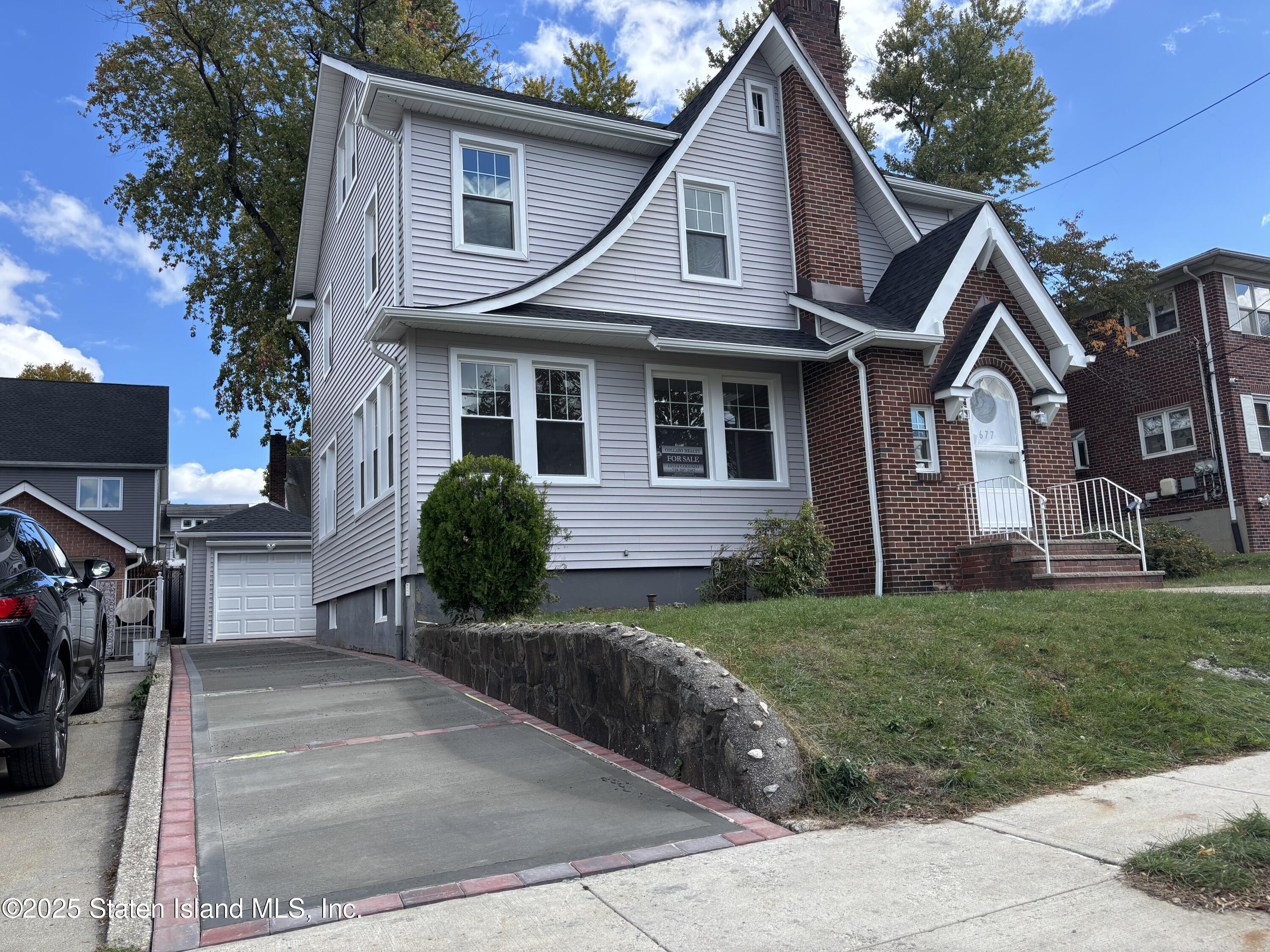 677 Bement Avenue Staten Island, NY 10310 - Photo 1 of 37 a front view of a house with a yard