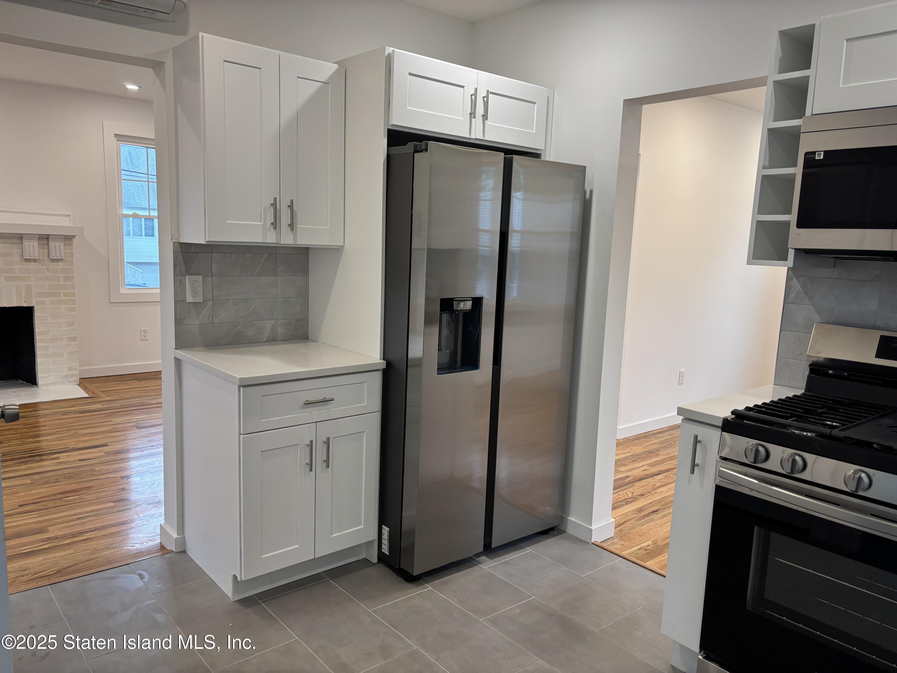 677 Bement Avenue Staten Island, NY 10310 - Photo 11 of 37 a kitchen with stainless steel appliances granite countertop a refrigerator and a stove