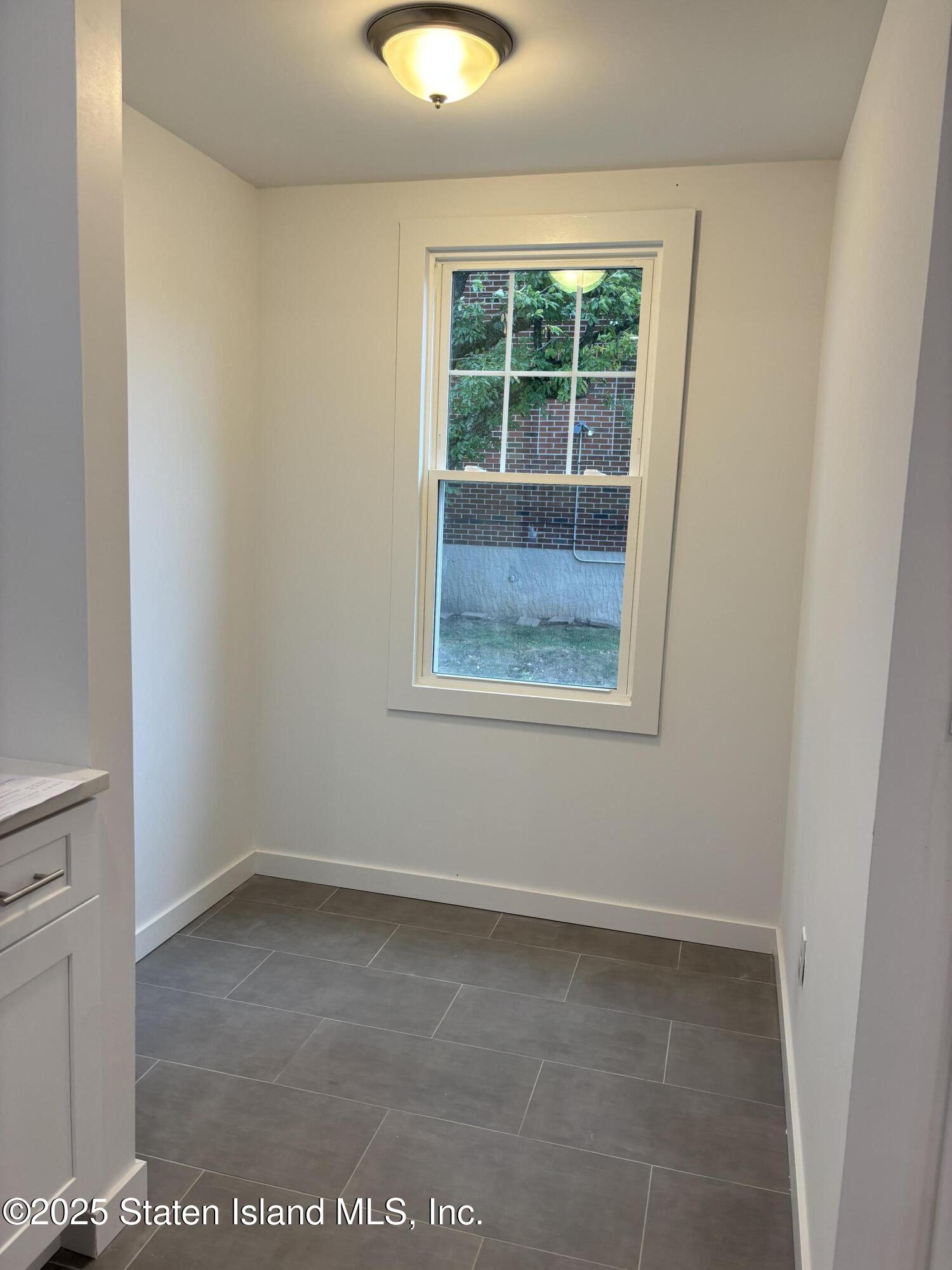 677 Bement Avenue Staten Island, NY 10310 - Photo 13 of 37 an empty room with a window