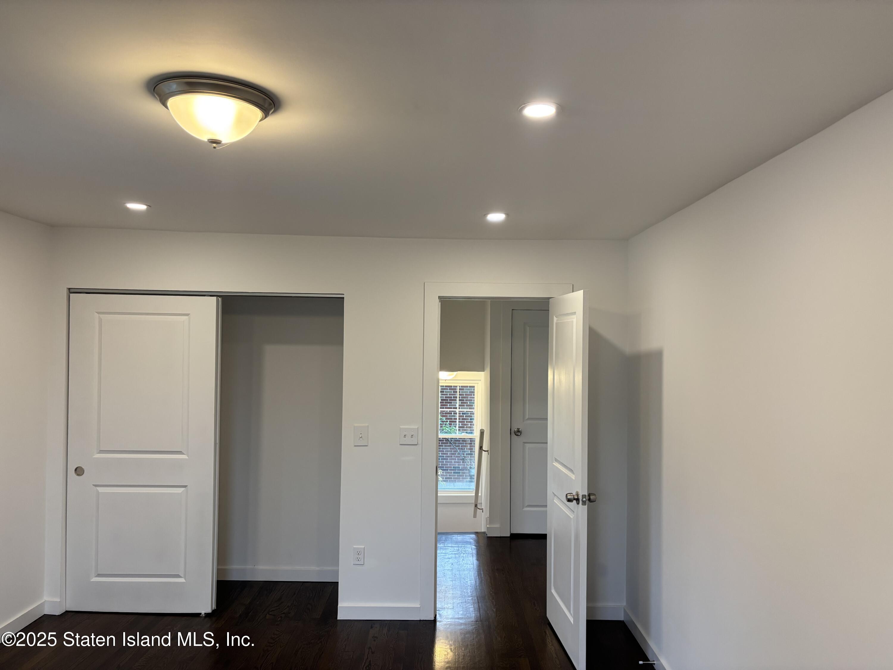 677 Bement Avenue Staten Island, NY 10310 - Photo 16 of 37 a view of a room with wooden floor and bathroom