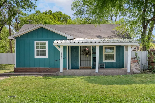 a house view with a garden space