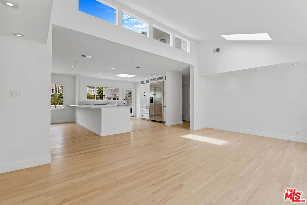 1462 Rising Glen Road Los Angeles, CA 90069 - Photo 14 of 40 a view of a kitchen with wooden floor and a sink