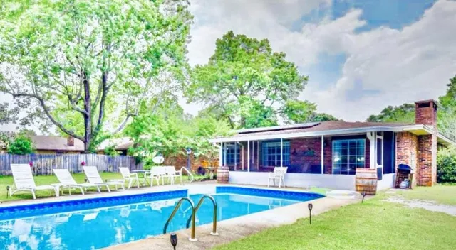 a view of a house with a swimming pool