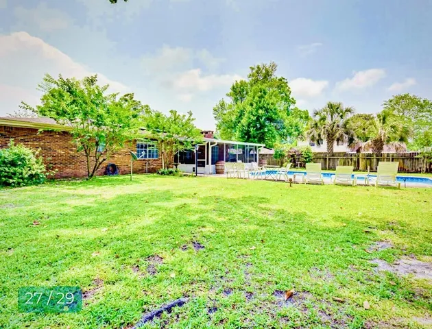 a view of a house with a big yard