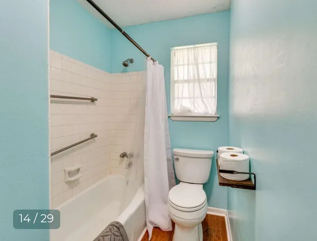 a bathroom with a toilet a sink and a bathtub